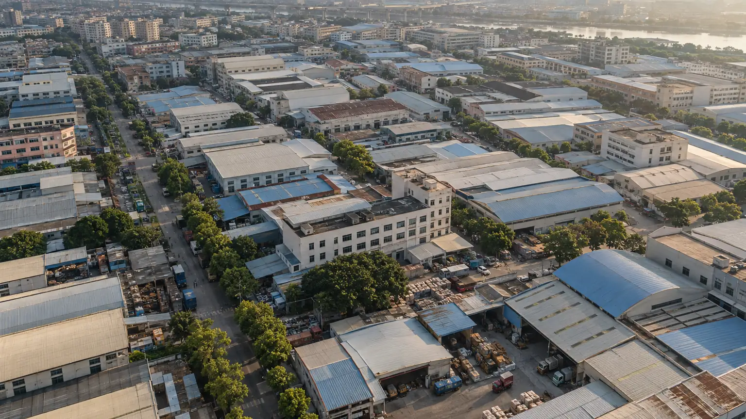Aerial view of a dense cluster of factory buildings and access roads in the Guangzhou area